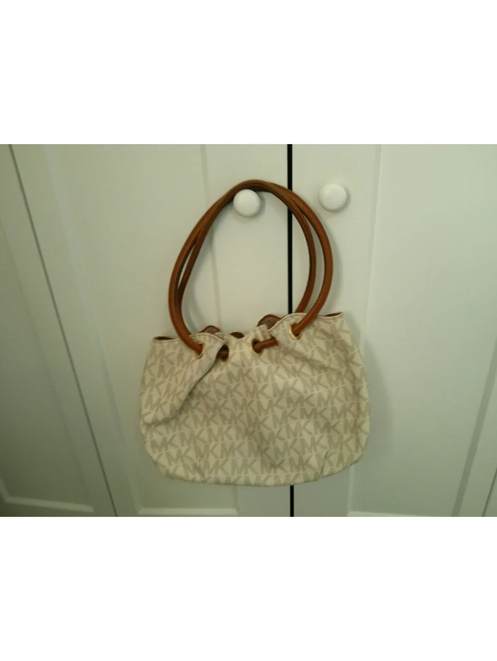Michael Kors Beige and Brown Monogram Tote Bag with Tassel Charm
